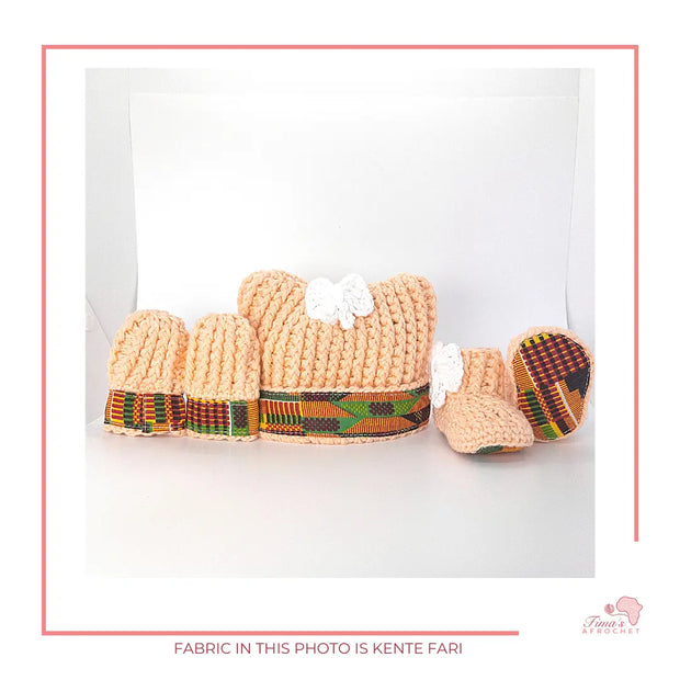 Image is a PEACH crochet bundle set which includes hat, booties, mittens. Each item has African fabric on the soles and rims.  Perfect for keeping baby stylish, comfortable and representing culture.