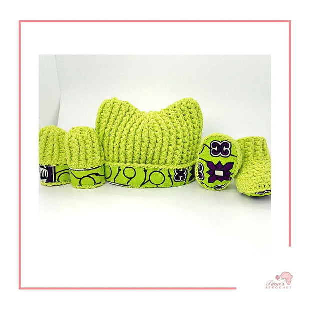 Image is a LIME GREEN crochet bundle set which includes hat, booties, mittens. Each item has African fabric on the soles and rims.