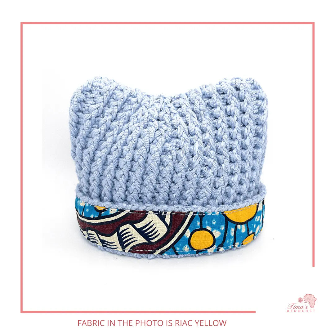 Image is a crochet light hat baby hat with authentic African Ankara fabric on the rim. Perfect for keeping baby stylish, comfortable and representing culture. 