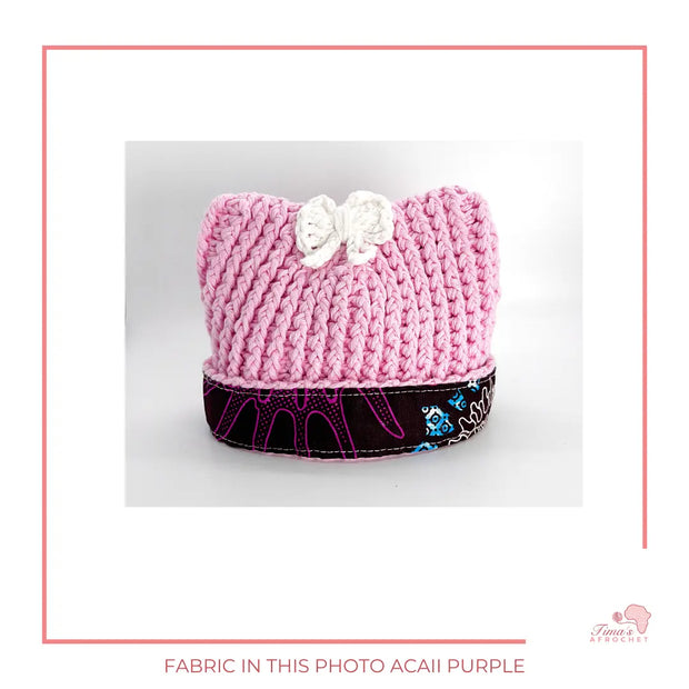 Image is a crochet pink baby hat with authentic African Ankara fabric on the rim. Perfect for keeping baby stylish, comfortable and representing culture. 