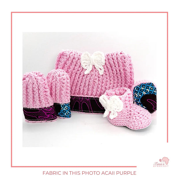  Image is a pink crochet bundle set which includes hat, booties, mittens. Each item has African fabric on the soles and rims.  Perfect for keeping baby stylish, comfortable and representing culture.