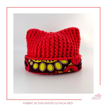 Image is a crochet red  baby hat with authentic African Ankara fabric on the rim. Perfect for keeping baby stylish, comfortable and representing culture. 