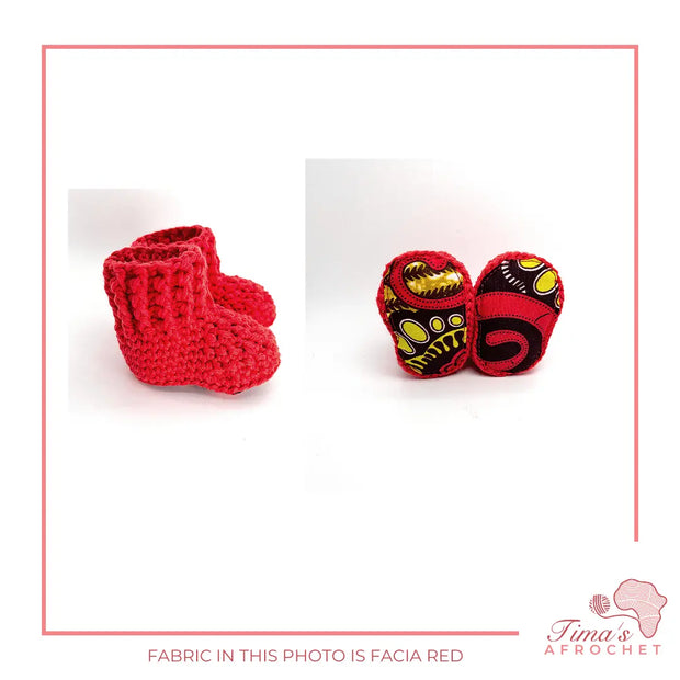 crochet baby booties in red with ankara fabric on the soles.